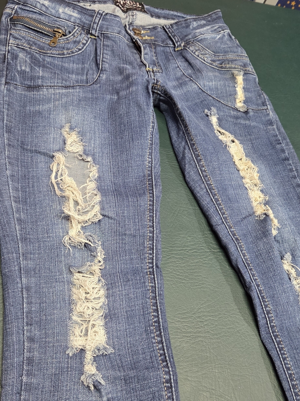 **Women’s Skinny Distressed Blue Jeans with Burgundy Patch Details** - Picture 11 of 11